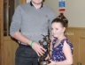 Conor McKeever accepts the Eugene Gribben Memorial trophy for Hurler of the Year from Hannah Gribben (Eugene’s daughter)